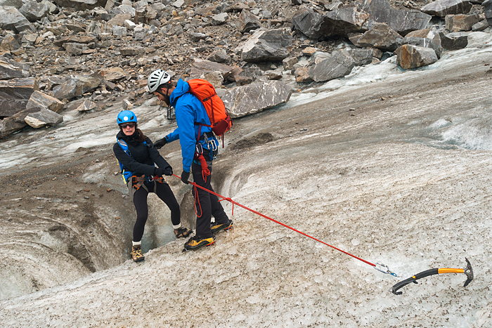 Guide spots a woman who nervously leans back over a deep crevasse on Lemon 