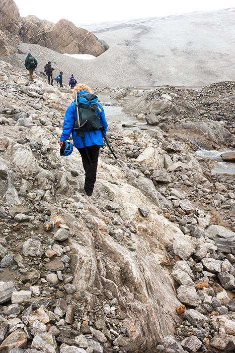 Walk over rocks to glacier, alaska