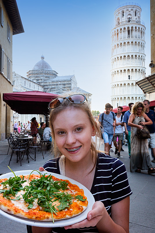 eating pizza in Pisa, Italy