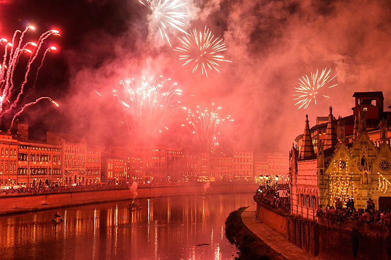 Pisa Luminara festival fireworks over Arno River