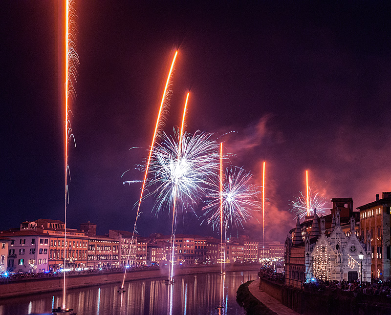 Pisa Luminara festival fireworks over Arno River