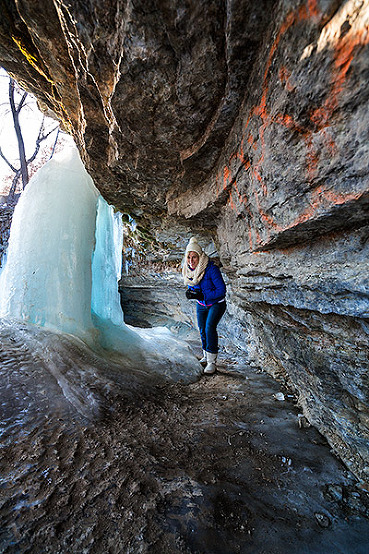 Exploring behind Minnehaha frozen waterfall in Minneapolis, Minnesota, USA