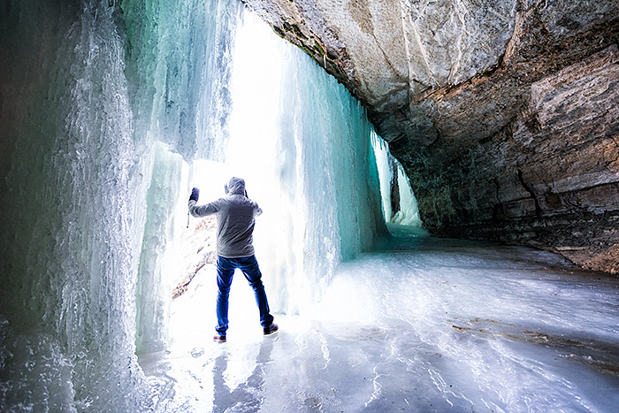 Exploring behind Minnehaha frozen waterfall in Minneapolis, Minnesota, USA