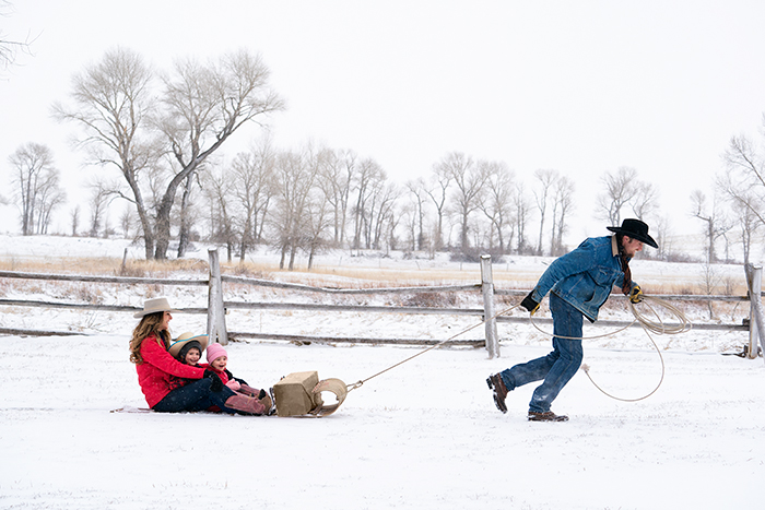 life-on-a-ranch-cowboy-culture-sledding-family-fun