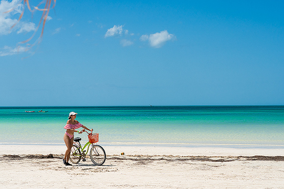 Biking across the beach at Isla Holbox, Mexico